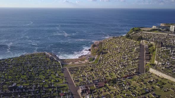 Graveyards on the cliff with spectacular Pacific Ocean view, aerial forward flying over most popular