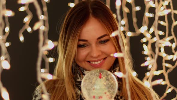 Cute Women in Front of Christmas Lights