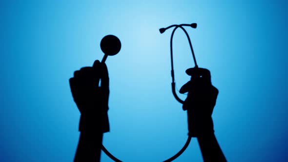 Shadow of Stethoscope on Blue Neon Background