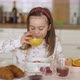 Healthy Kid Drinking Orange Juice During Breakfast - VideoHive Item for Sale