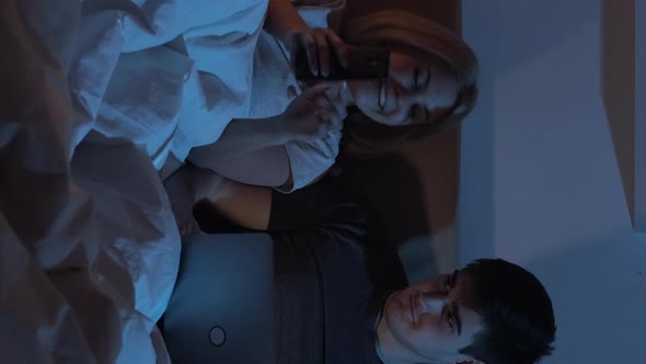 Night Online Gadget Couple in Bed Late Vertical