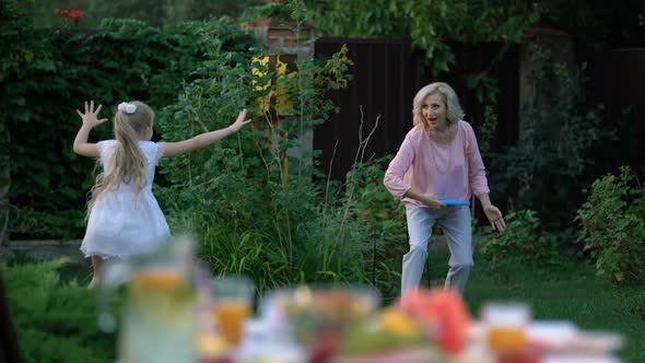 Grandma Teaches Granddaughter How to Play Throw and Catch Game, Active Lifestyle