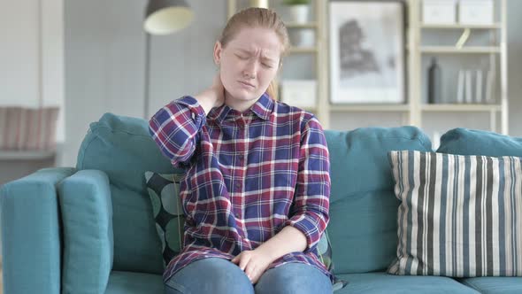 Young Woman Sitting While Having Neck Pain