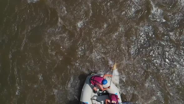 Slow Motion Group of People Rafting on a Mountain River