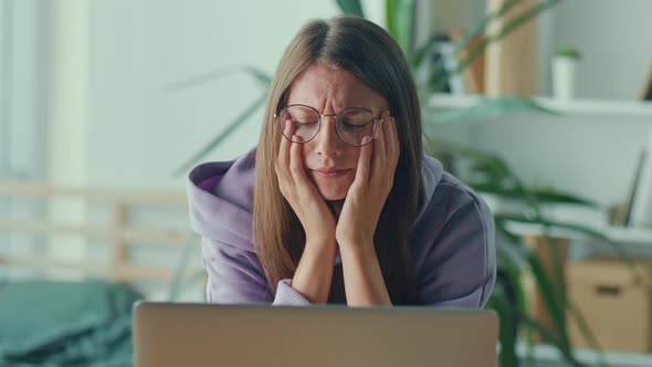 Anxious Sad Woman Looking at Laptop Feeling Frustrated of Bad News