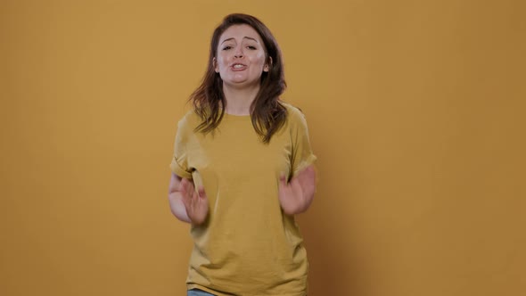 Happy Woman Gesturing Making Heart Sign with Hands to Show Loving Feelings for Her Partner