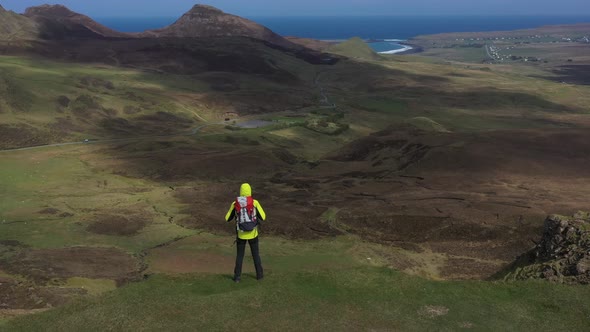 Man adventurer with backpack exploring Isle of Skye