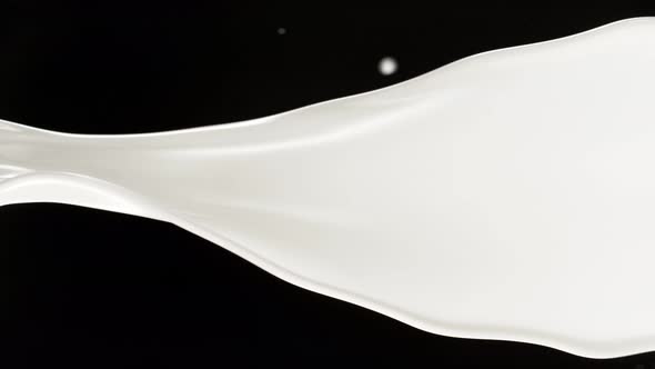 Super Slow Motion Shot of Cream Spiral Splash Isolated on Black Background at 1000 Fps alt