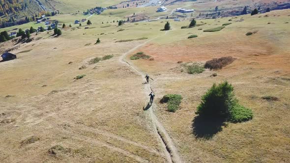 Aerial drone view of a mountain biker on a singletrack trail
