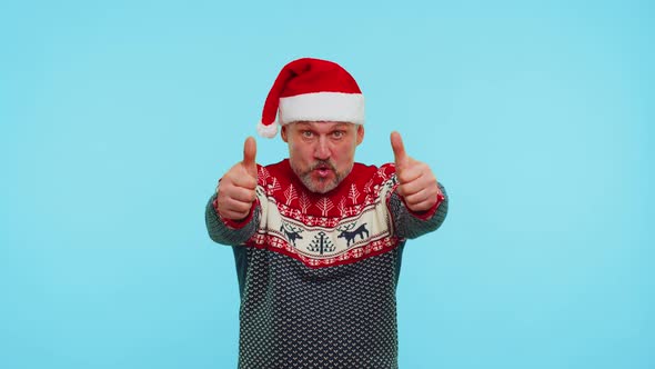 Funny Man Wears Red New Year Sweater with Deers Raises Thumbs Up Agrees with Something Good Like