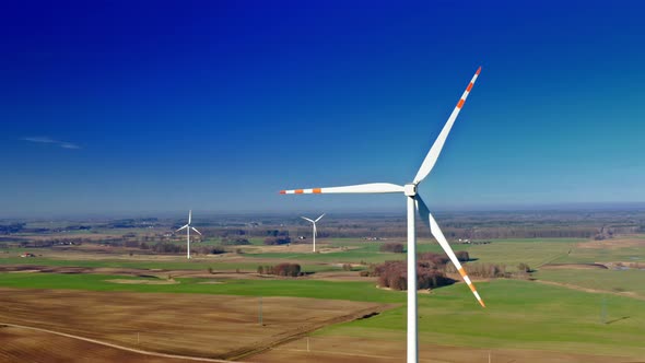 Aerial view of white wind turbines in a field, Poland