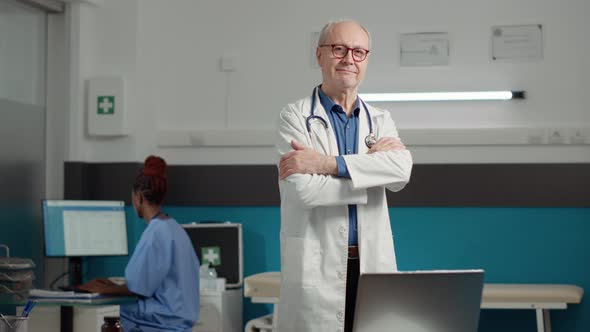 Portrait of Male Physician Waiting to Attend Appointment with Patient