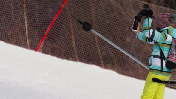 Amateur Skier Girl on a Lift