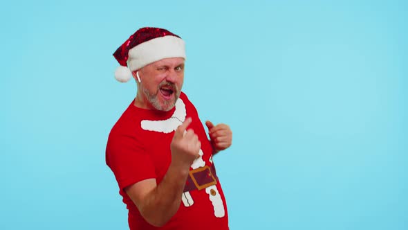 Man in Christmas Tshirt Listening Music Via Earphones Dancing Disco Fooling Around Having Fun