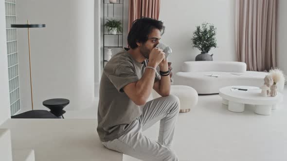 Man Talking on Phone at Home