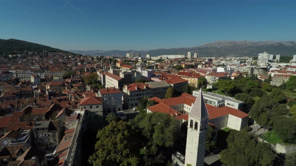 Aerial shot of a bell tower and old buildings