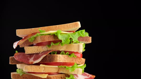 sandwich on black background rotating