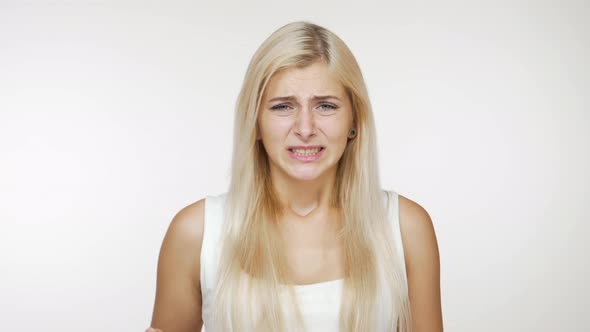 Facial Expressions of Blondie Girl Politely Saying No with Caution Waving Hand in Refusal Over White