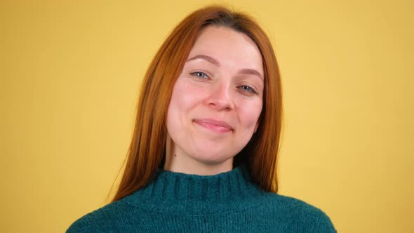 Young Red Hair Woman Posing Isolated on Yellow Color Background Studio