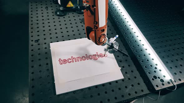 Robotic Arm Is Writing on Paper with a Sharpie