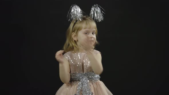 Happy Beautiful Little Baby Girl in Glossy Dress