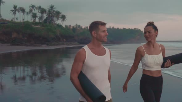 Couple Walking by Ocean Shore