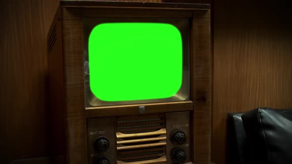 1950s TV Green Screen against Wooden Wall. Zoom Out.