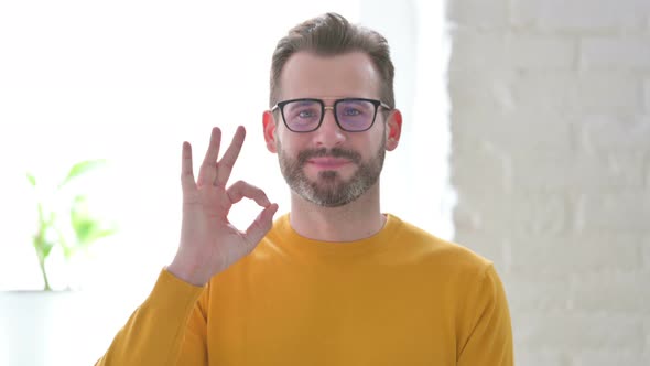 Portrait of Man Showing Ok Sign with Finger