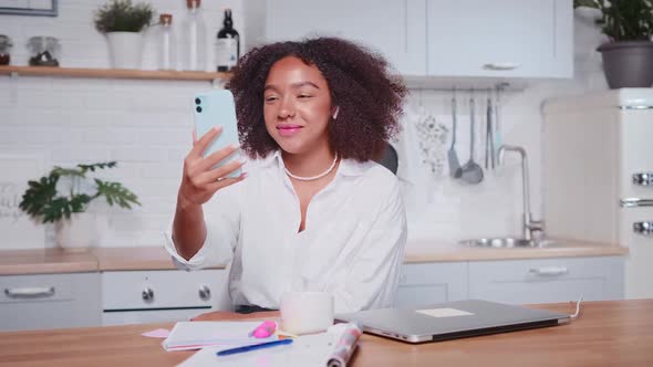 Attractive Cheerful African American Woman Talking By Video Call on Phone
