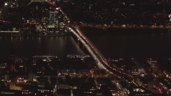 AERIAL: Beautiful Wide Shot Over Cologne Germany with River Rhine and Bridge Car Traffic and City