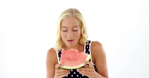 Beautiful woman eating watermelon