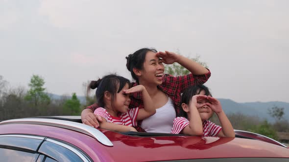 Happy family enjoying road trip on summer vacation.