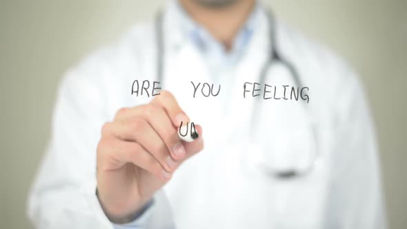 Are You Feeling Unwell ?, Doctor Writing on Transparent Screen