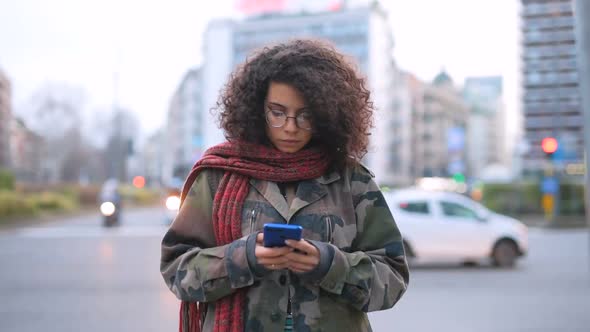 Time lapse young multi ethnic woman outdoor using smart phone