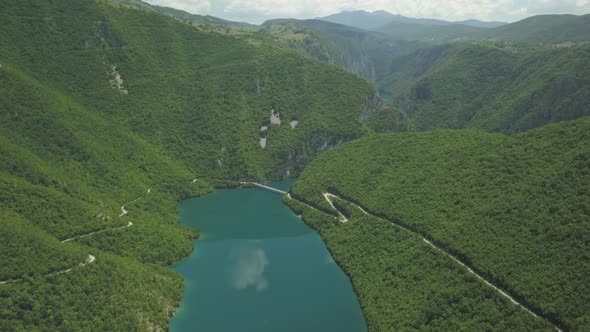 Aerial view of mountains and Piva lake in Montenegro in summer time