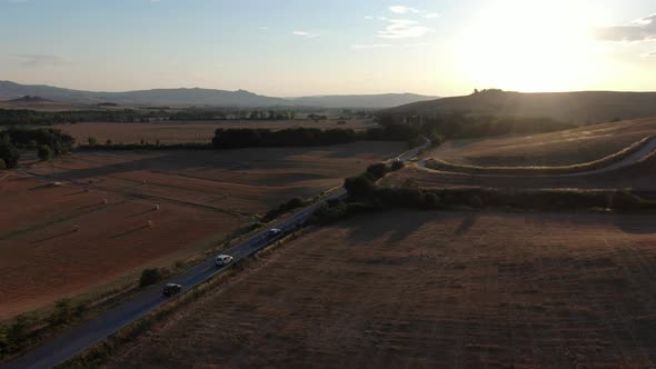 Aerial view of a road during sunset in Tuscany, Italy, Europe