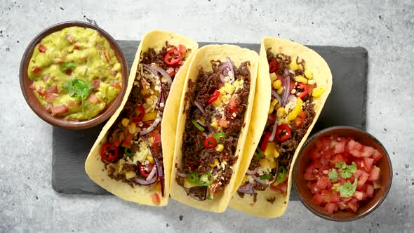Tasty Mexican Meat Tacos Served with Various Vegetables and Salsa
