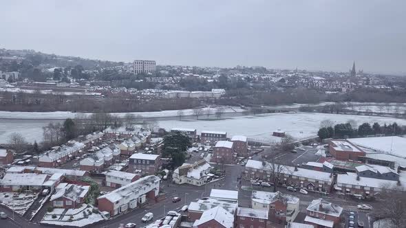 Push forward drone shot of a snowy Exeter looking towards the River Exe
