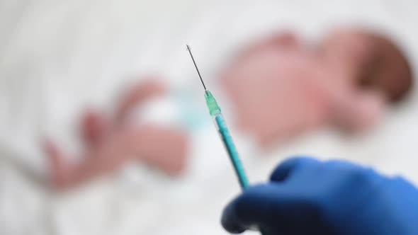 Pediatrician Vaccinating Newborn Baby