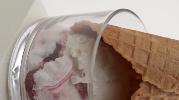 Vertical video: Peach ice cream in a glass