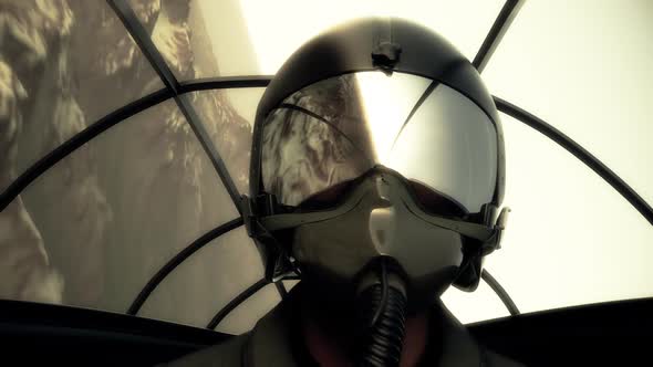 The pilot wearing a helmet and a mask in the cockpit is flying a jet fighter.