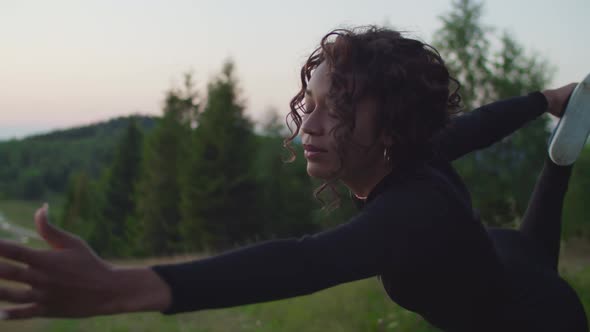 Portrait of Active Sporty Fitness Black Female Practicing Yoga Stretch Exercise in Mountains at