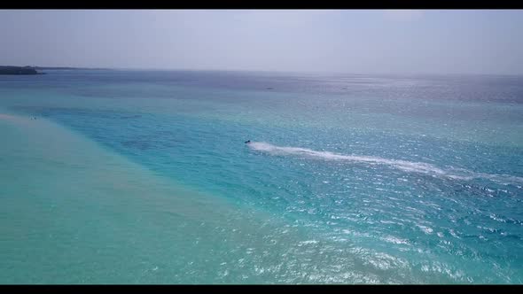 Aerial drone shot texture of exotic shore beach journey by turquoise ocean with white sand backgroun