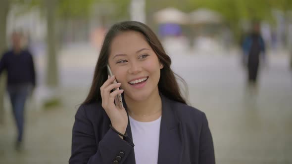 Cheerful Girl Talking By Cell Phone Outdoor