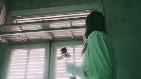 Beautiful Woman in an abandoned green Room