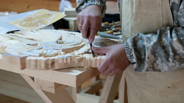 The Carpenter Creates a Basrelief