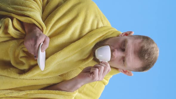 Ill Young Man Drinking Tea