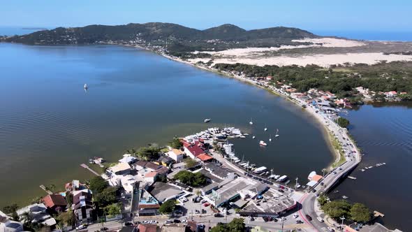 Aerial drone view of urban center in lagoon close to dunes and beaches.