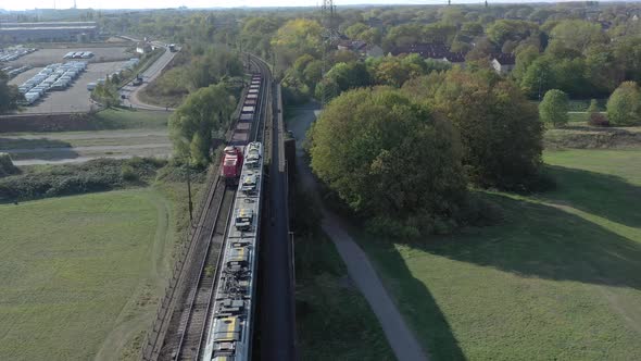 Commuter Train Stopped to Allow a Freight Train to Pass