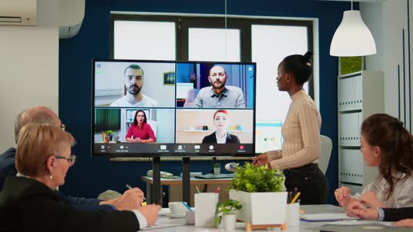 Black Manager Woman Talking with Remotely Colleagues on Video Call